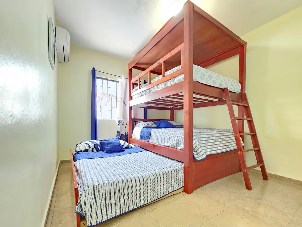 The third bedroom, with bunks and a pull-out bed alongside