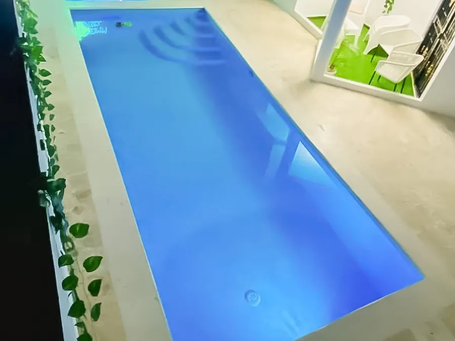 The pool lit blue after dark