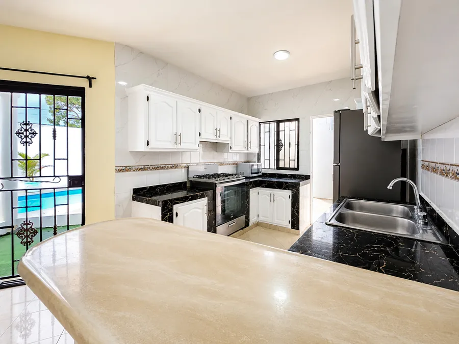 The kitchen counter, looking out to the pool