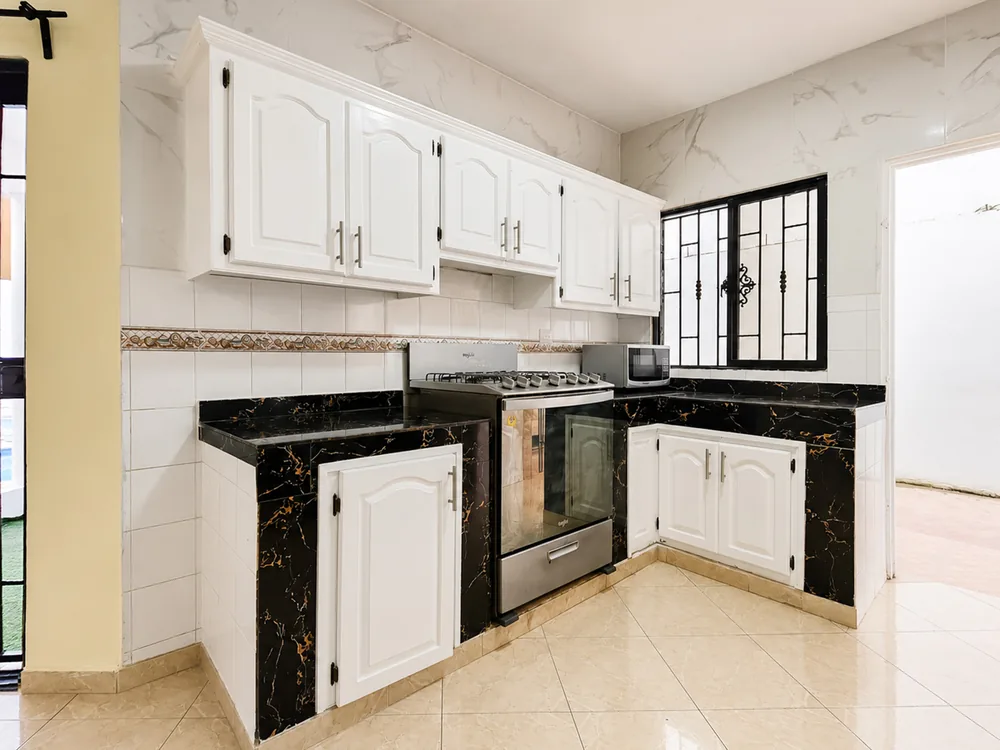The villa's kitchen with full-size cooker and counter space